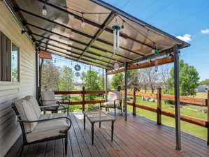 Wooden deck featuring a yard