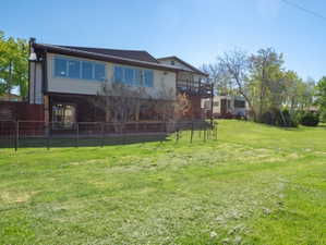 View of yard featuring a balcony
