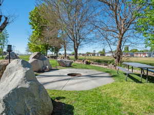 View of home's community featuring basketball hoop