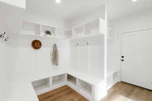 Mudroom with light wood-type flooring and recessed lighting