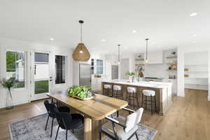 Dining room featuring light wood finished floors and recessed lighting