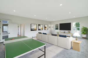 Carpeted living area featuring recessed lighting