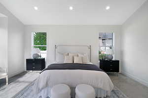 Carpeted bedroom with recessed lighting