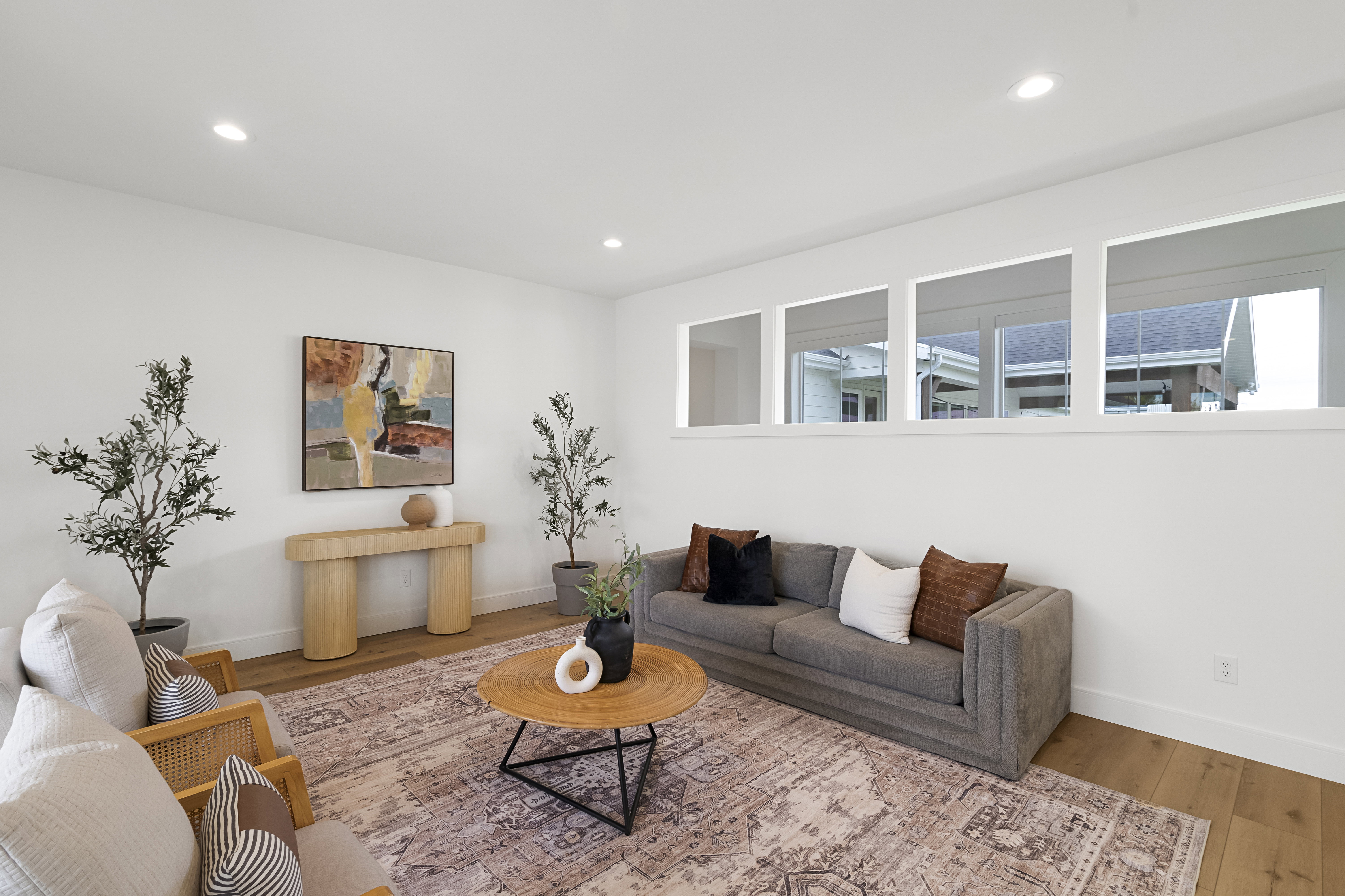 Living area featuring wood finished floors and recessed lighting