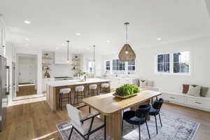 Dining space featuring light wood-type flooring and recessed lighting