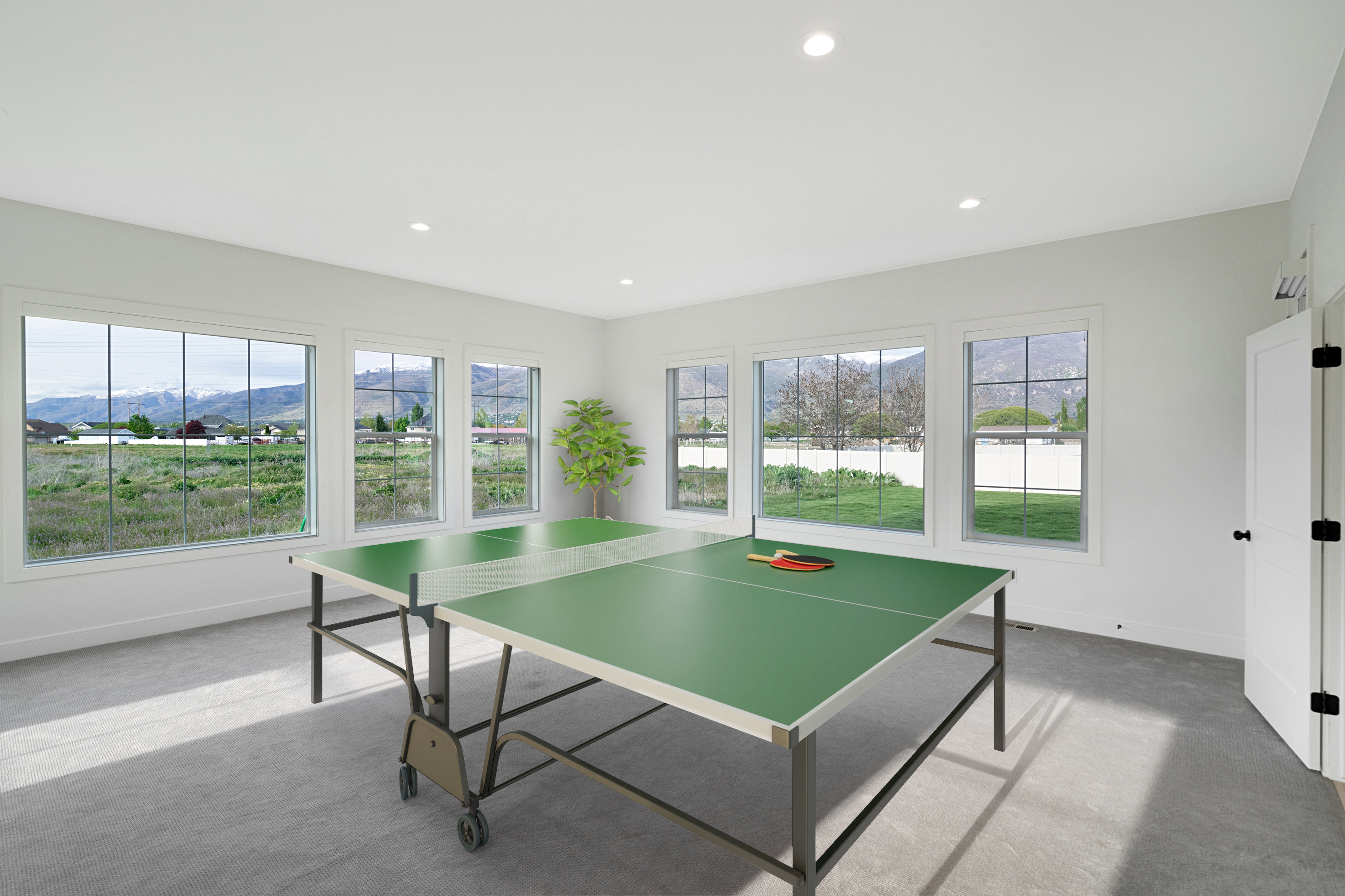 Game room with a mountain view, carpet, plenty of natural light, and recessed lighting