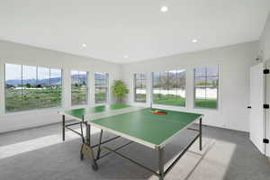 Game room with a mountain view, carpet, plenty of natural light, and recessed lighting