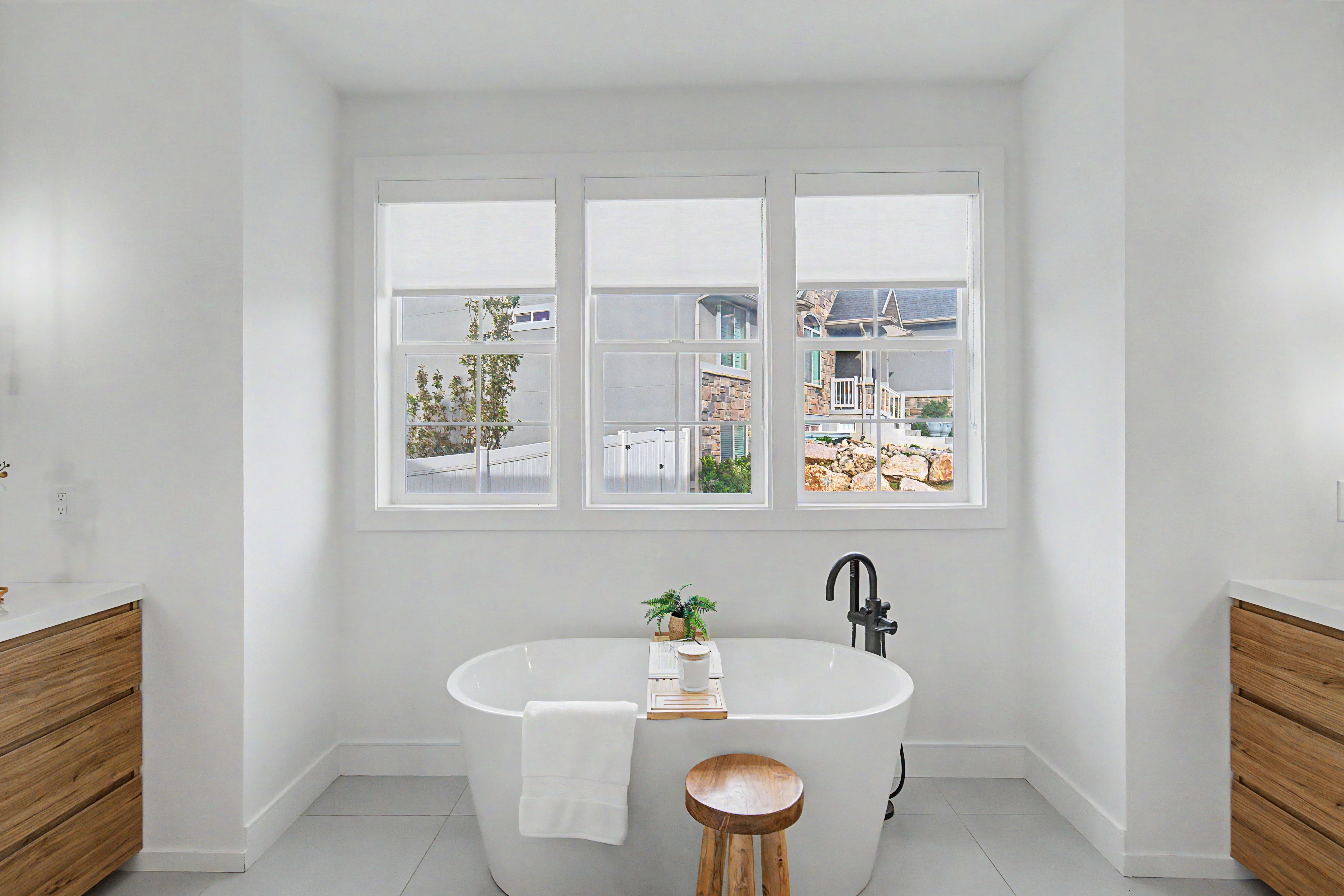 Full bathroom with vanity, a soaking tub, and light tile patterned floors