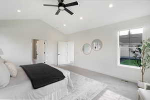 Bedroom featuring ceiling fan, recessed lighting, and a high ceiling