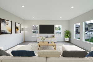 Living area with plenty of natural light and recessed lighting