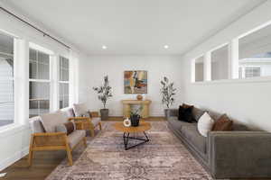 Living room featuring wood finished floors and recessed lighting