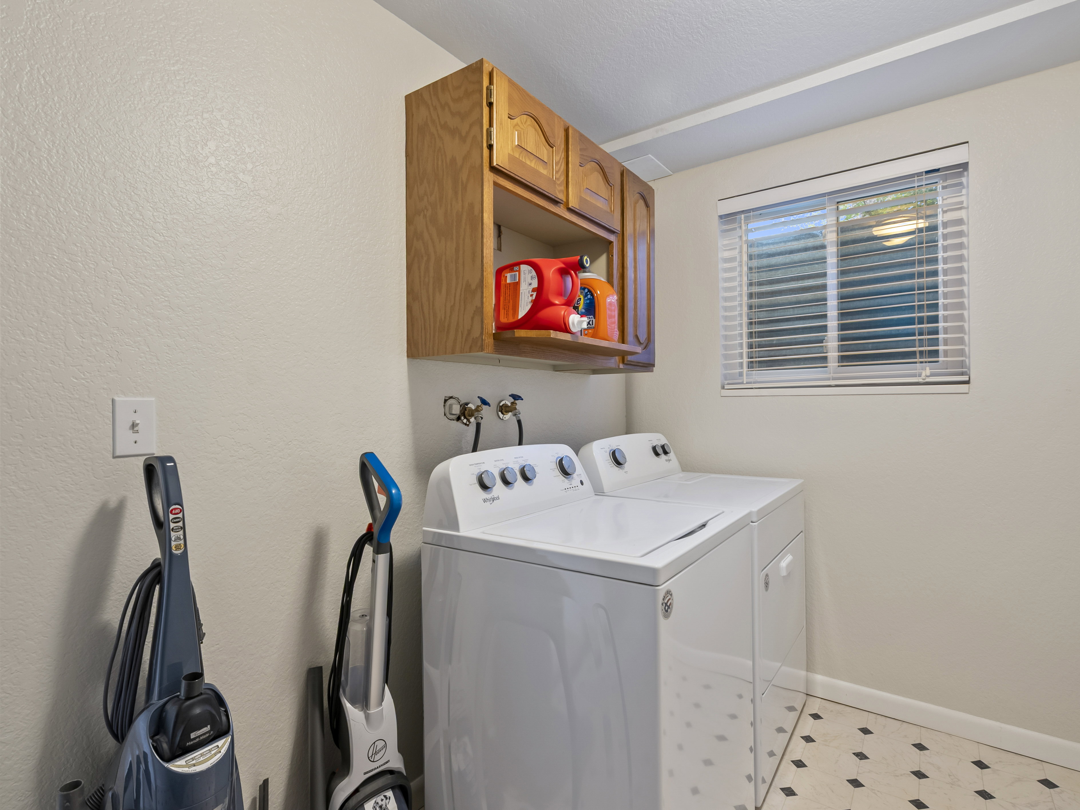 Laundry room with cabinet space and independent washer and dryer