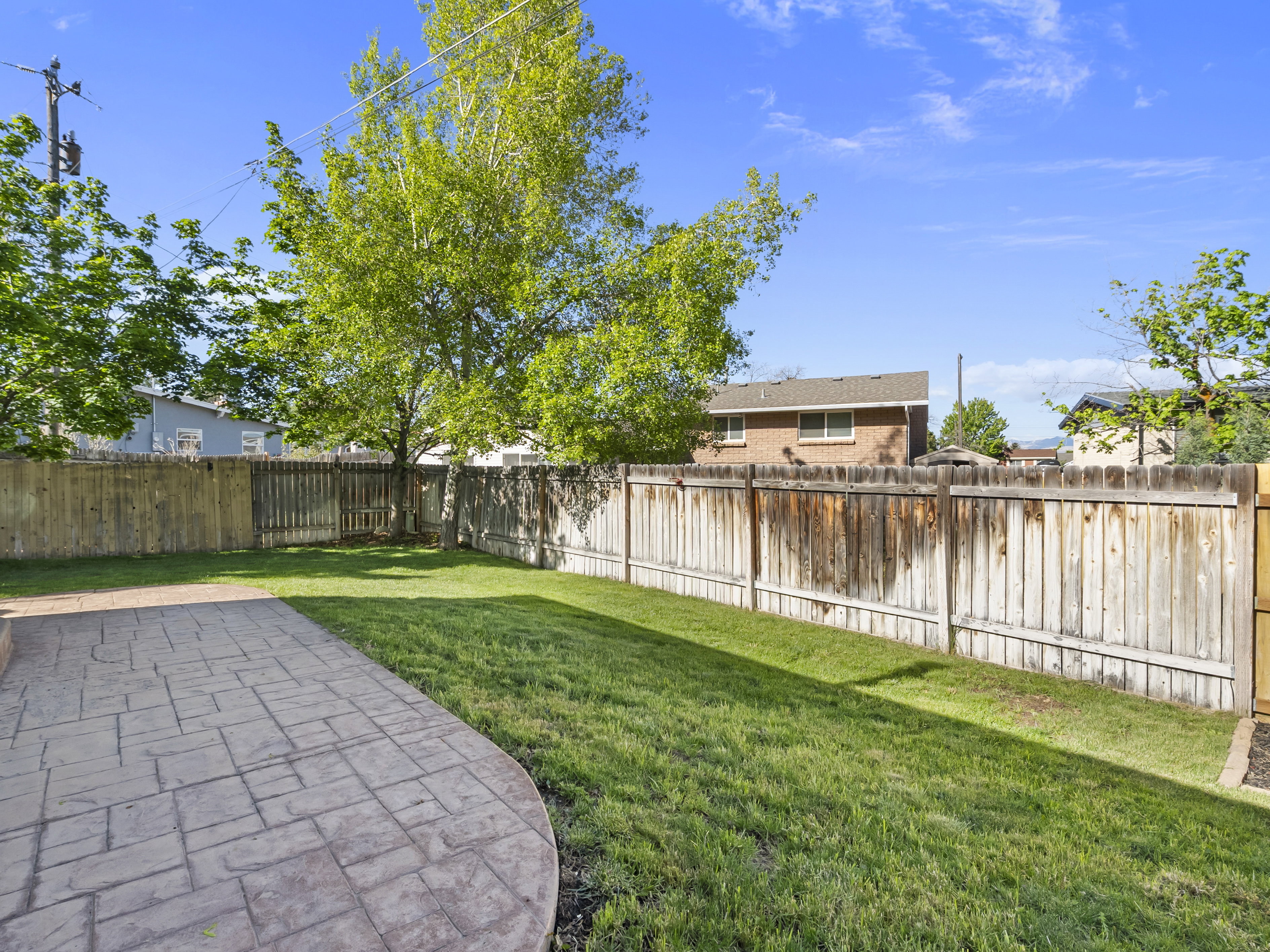 View of fenced backyard
