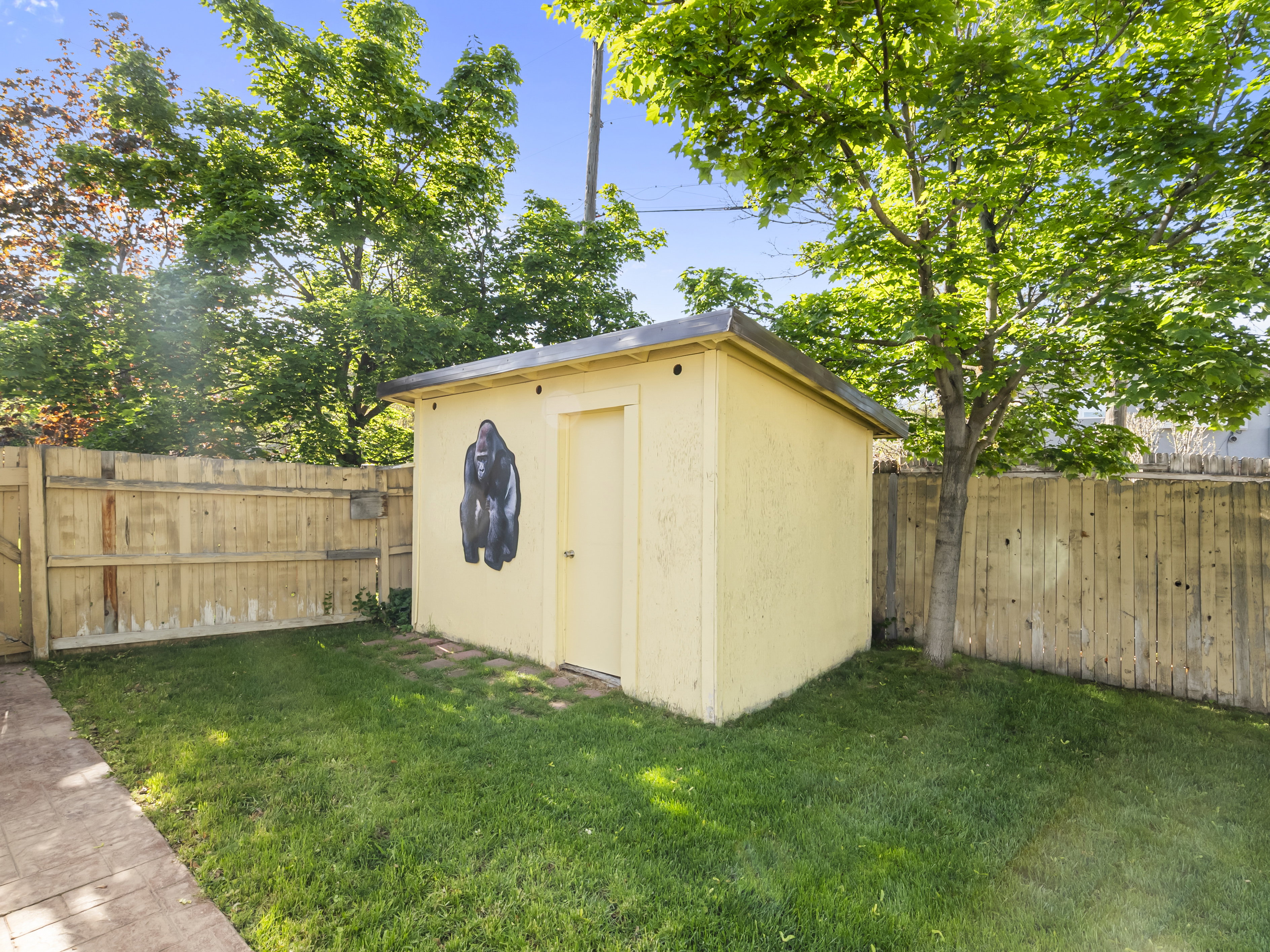 View of shed with a fenced backyard