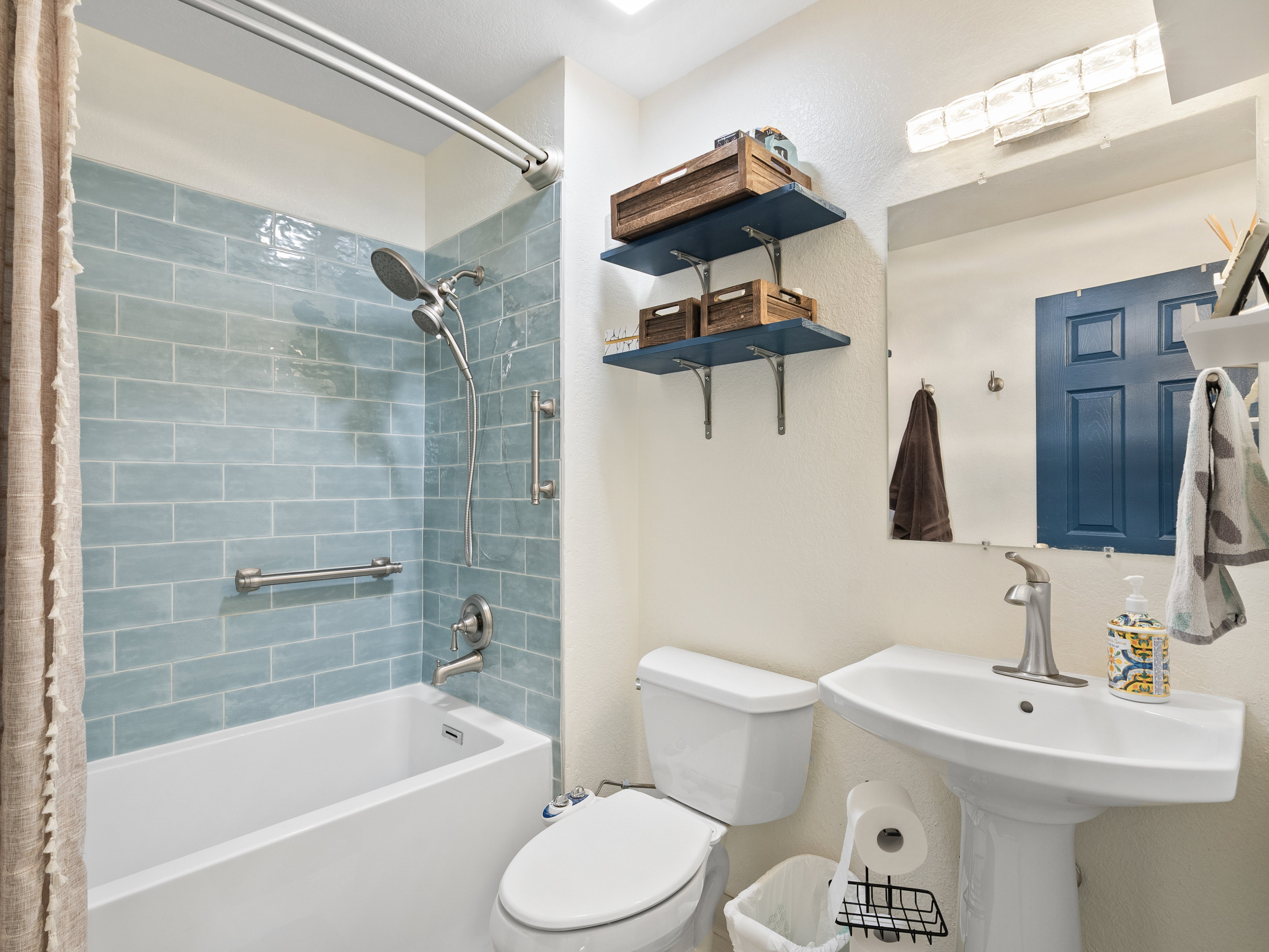 Bathroom with toilet and shower / bath combo
