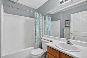 Bathroom with vanity and shower / tub combo