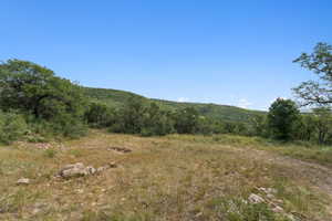 View of local wilderness with a mountainous background and rural landscape