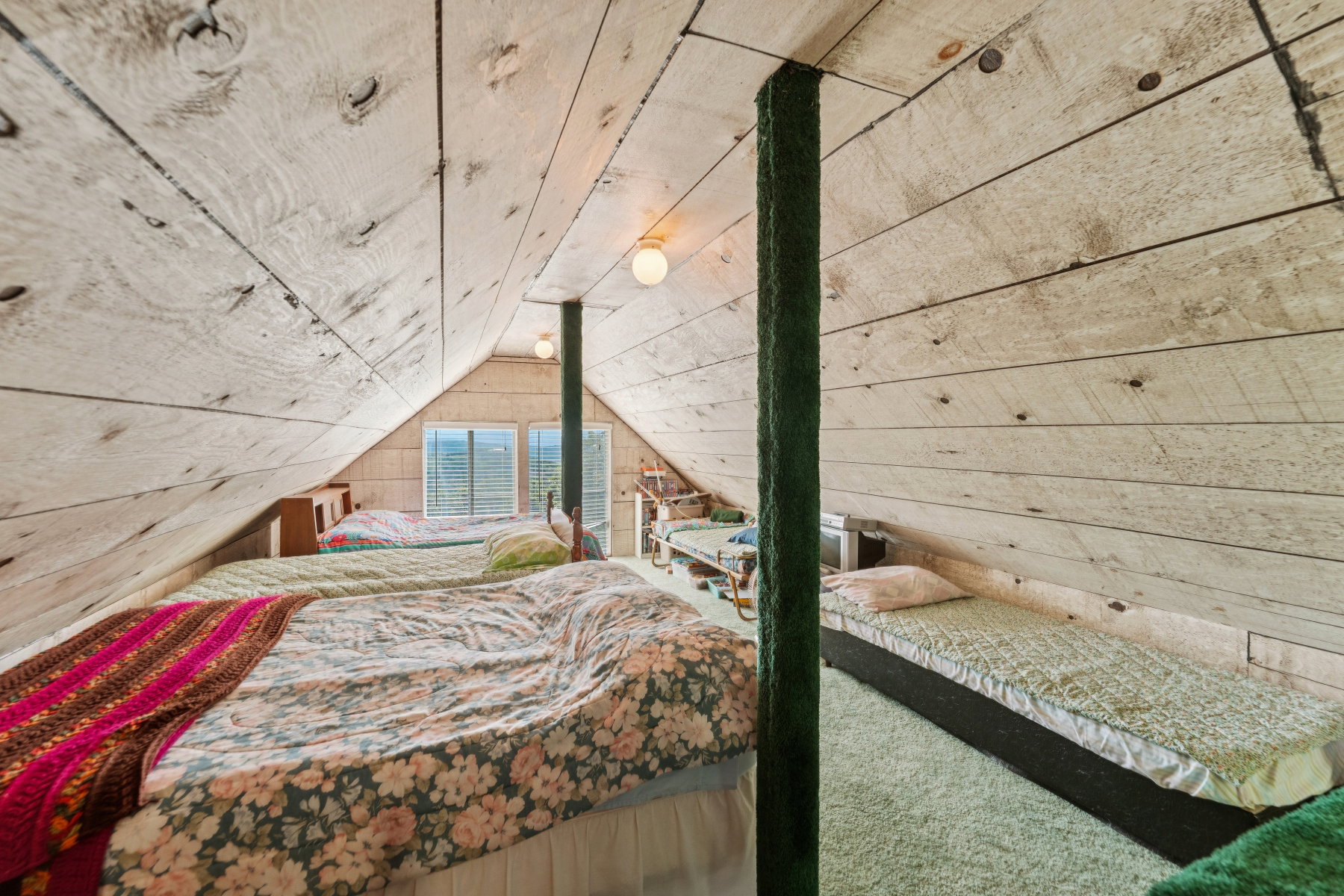 Bedroom featuring wooden walls