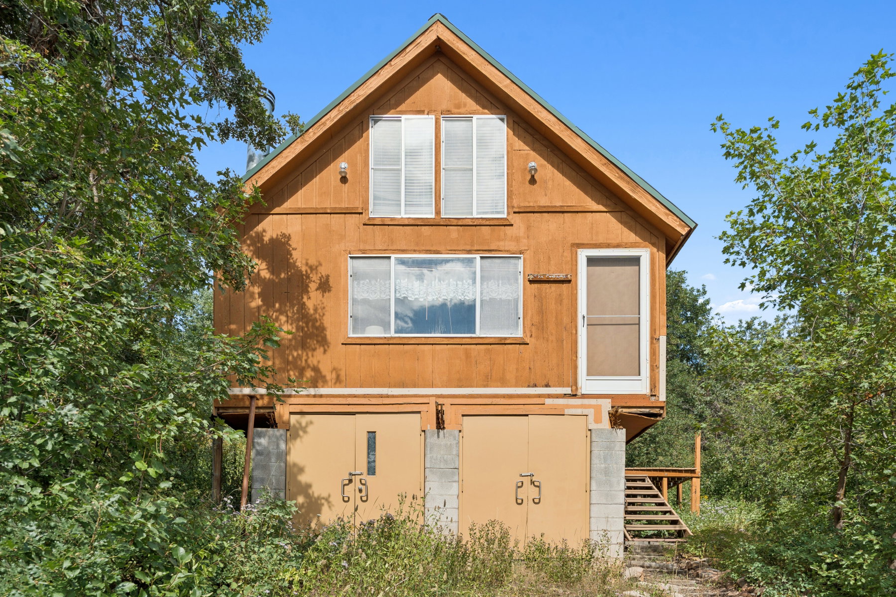 View of home's exterior featuring stairway