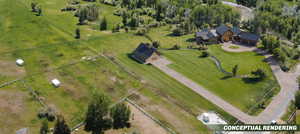 Extensive property featuring a large residence, separate outbuilding, and expansive green lawns