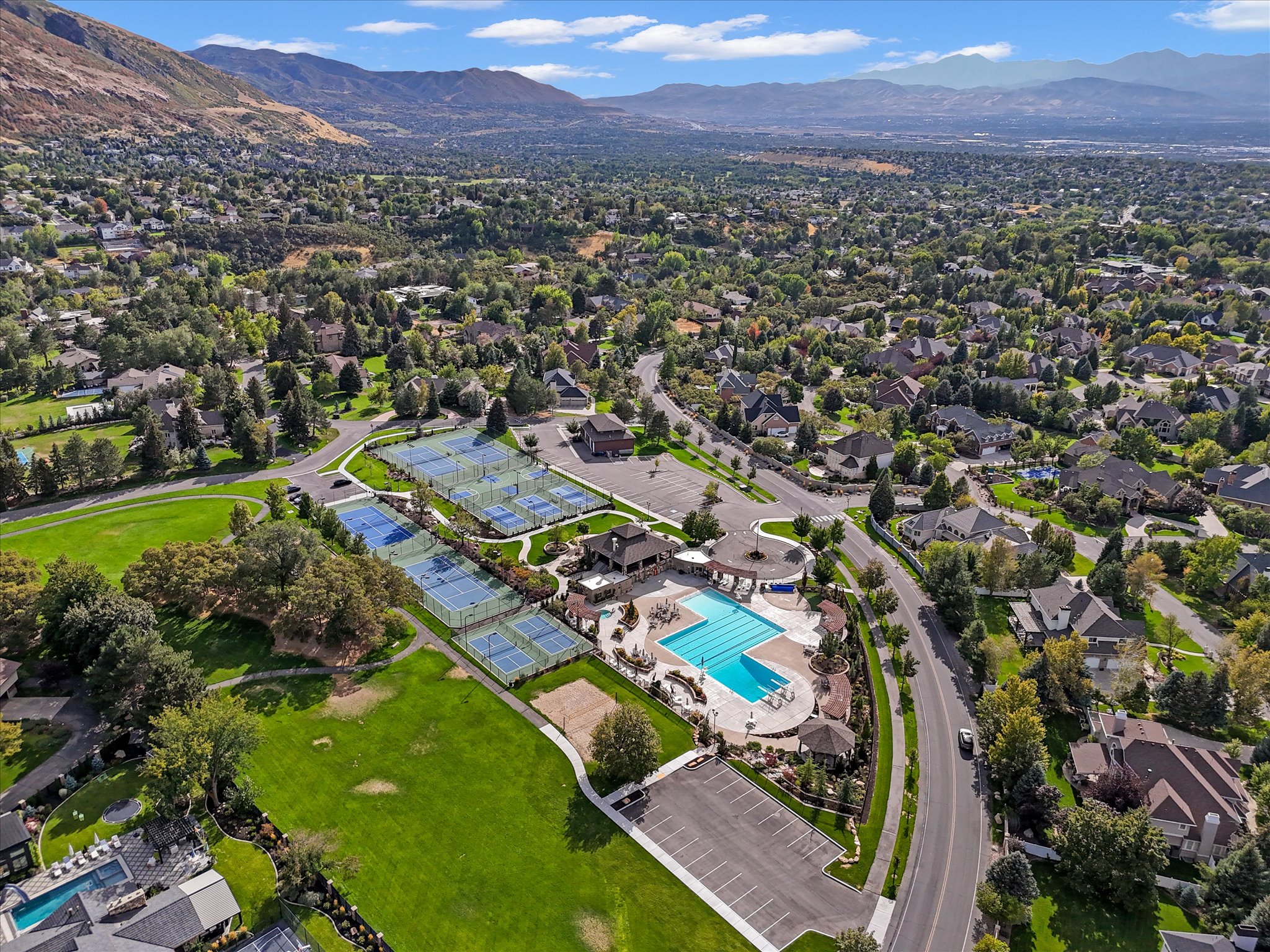 Aerial perspective showcasing a residential community with abundant green spaces