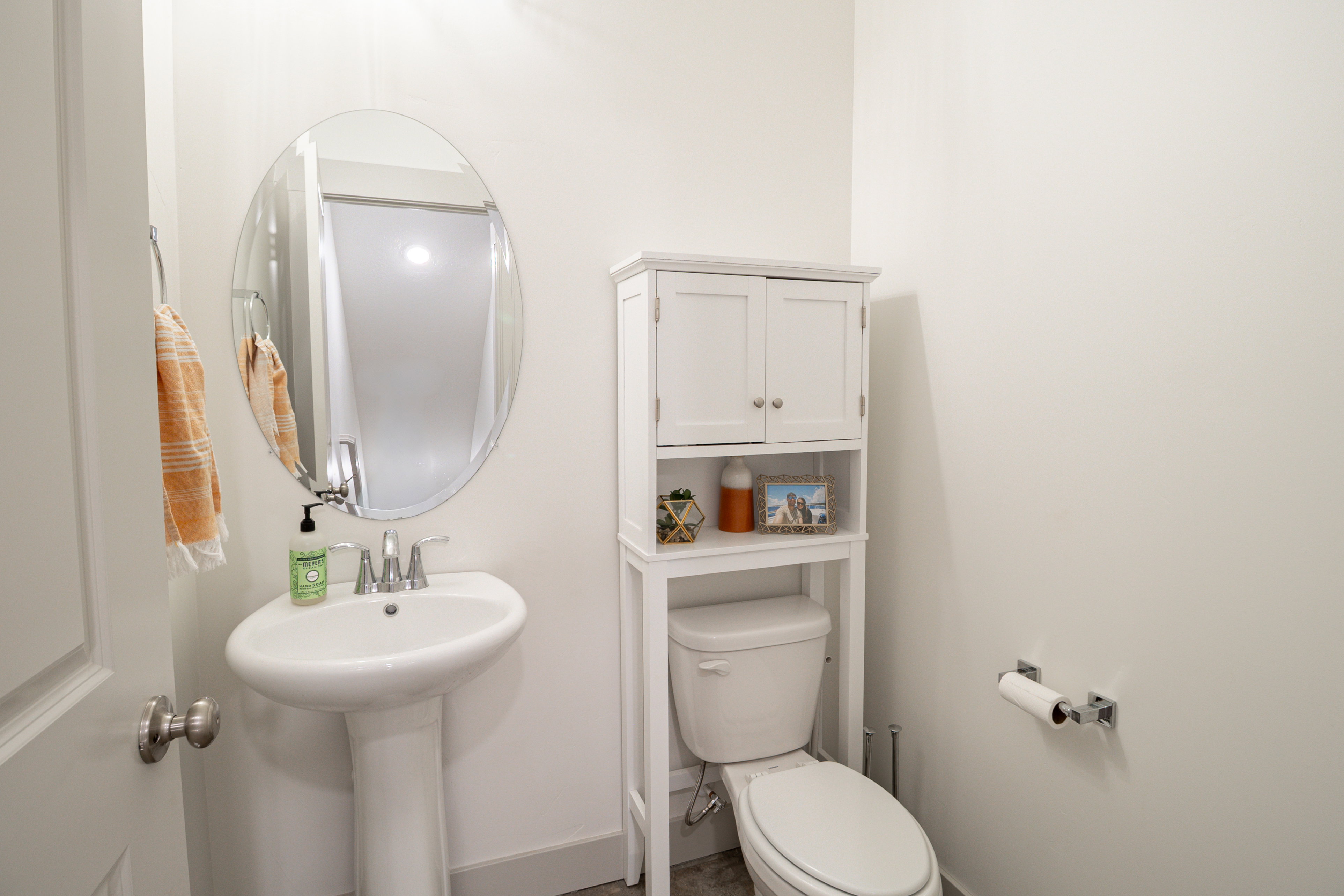 Half bathroom featuring toilet and a sink