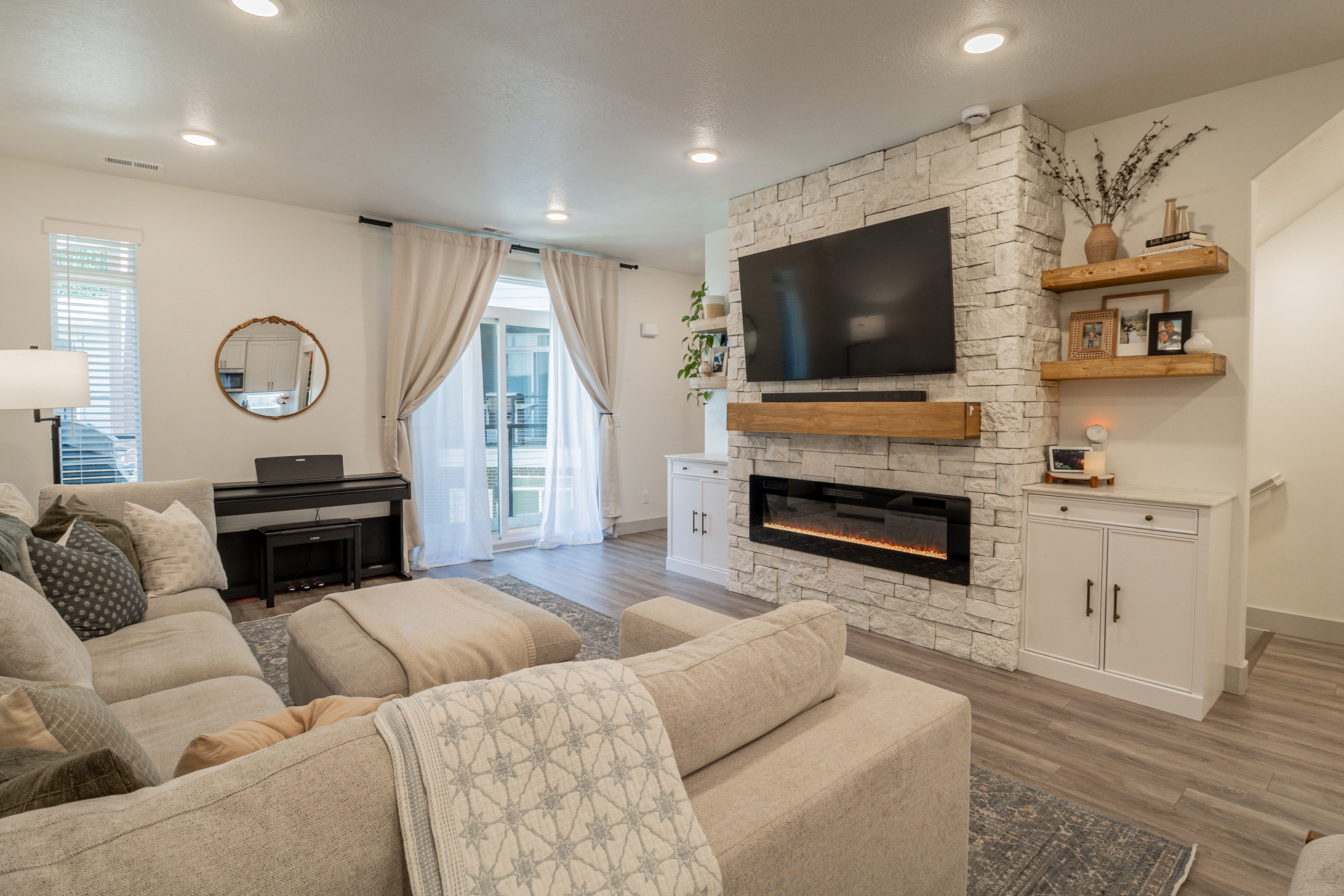 Living area featuring a fireplace, dark wood-type flooring, plenty of natural light, and recessed lighting