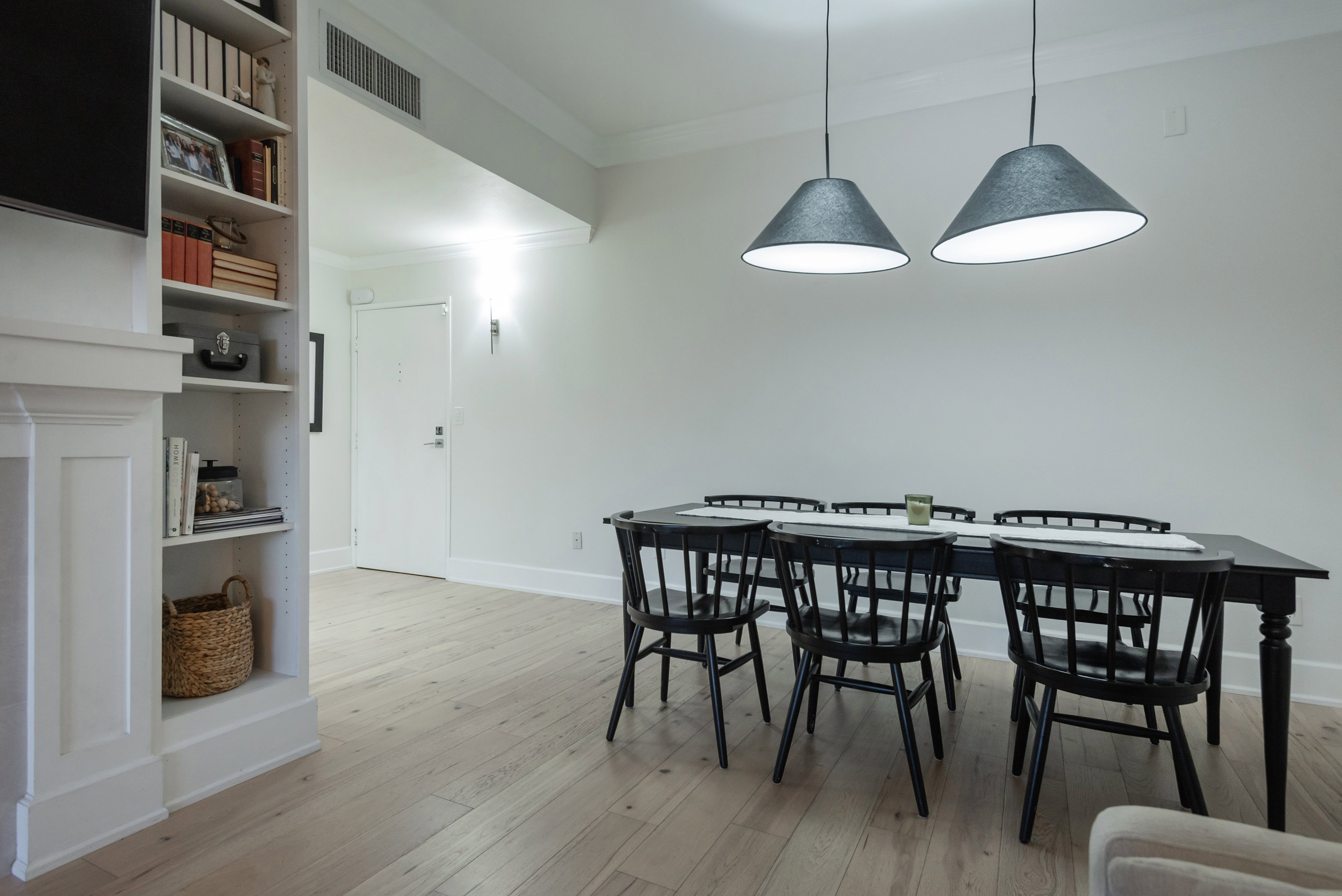 Dining space with crown molding and light wood-style flooring