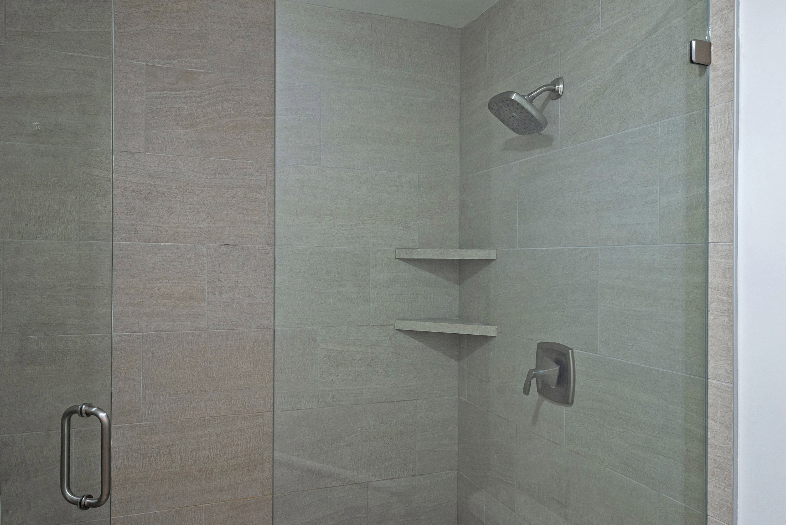 Full bathroom with a shower stall