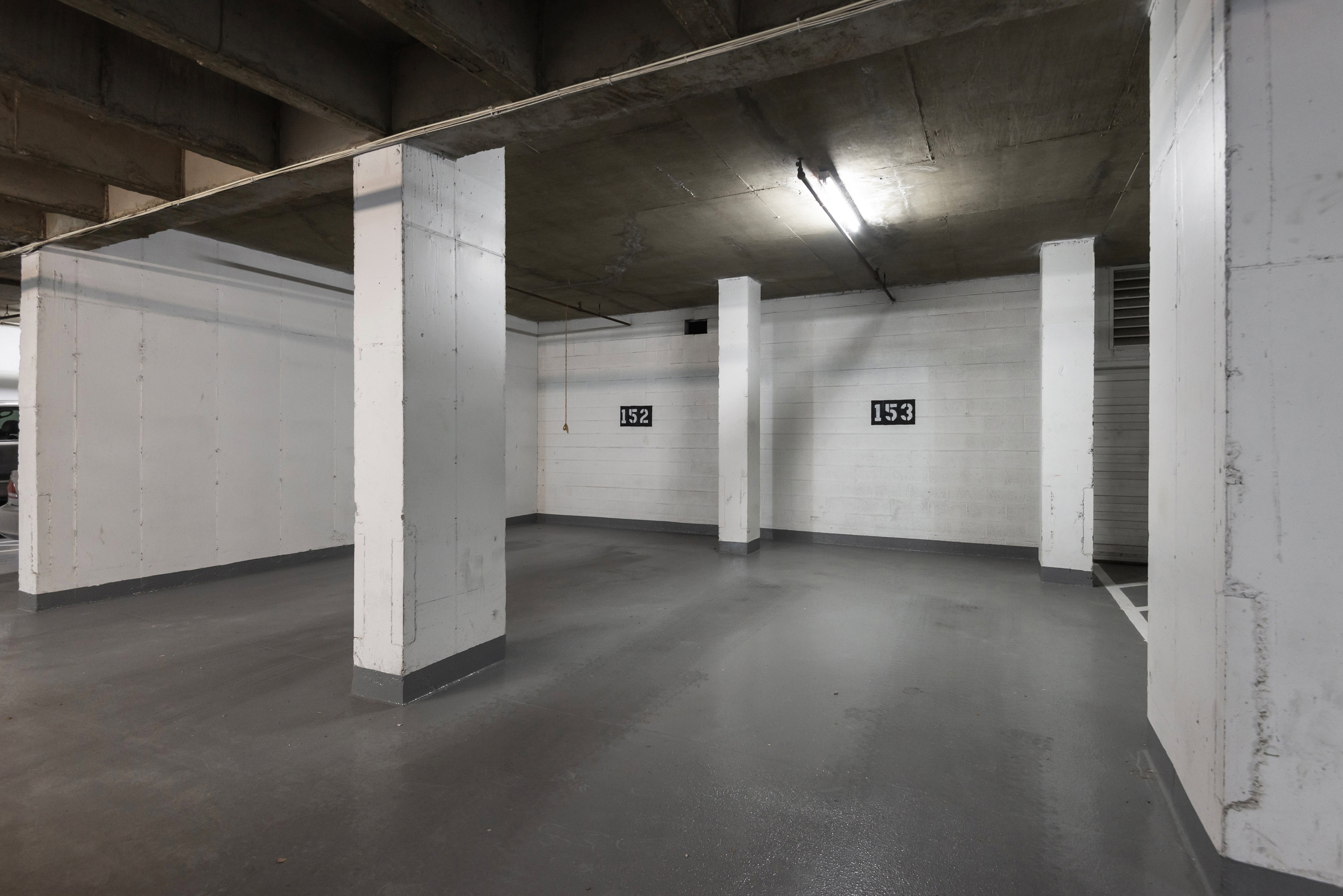 Garage featuring a parking deck