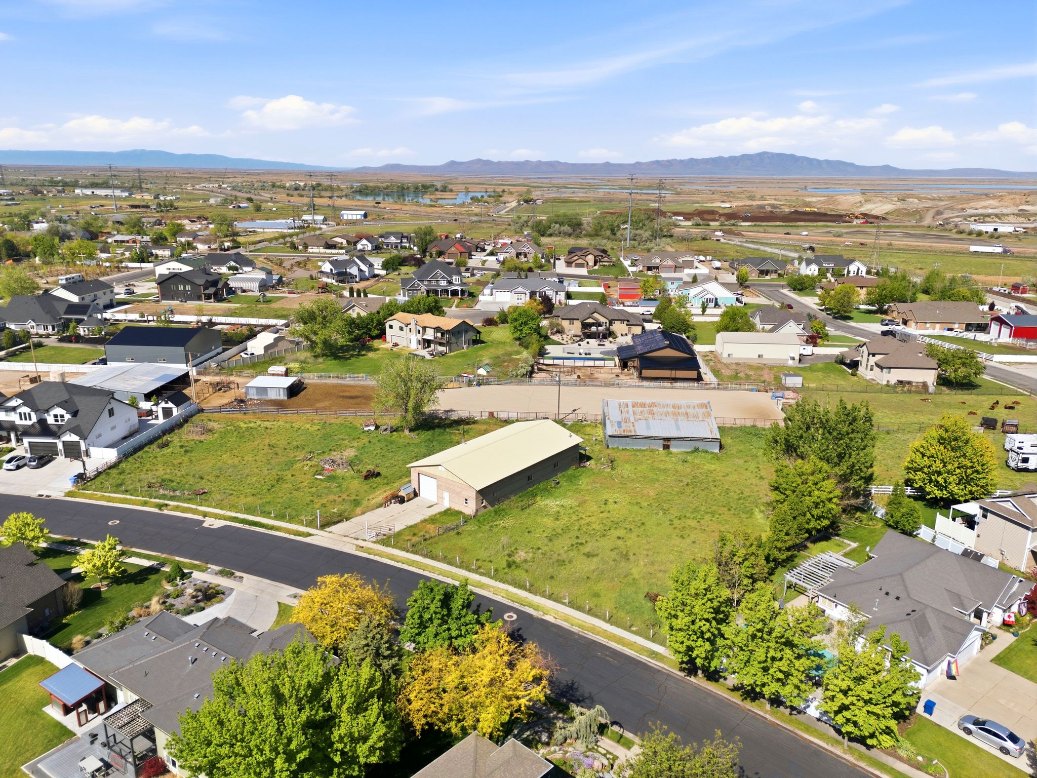 Aerial perspective of suburban area with a mountainous background