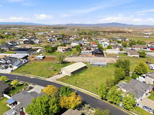 Aerial perspective of suburban area with a mountainous background