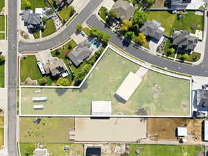 Aerial view of residential area with property parcel outlined