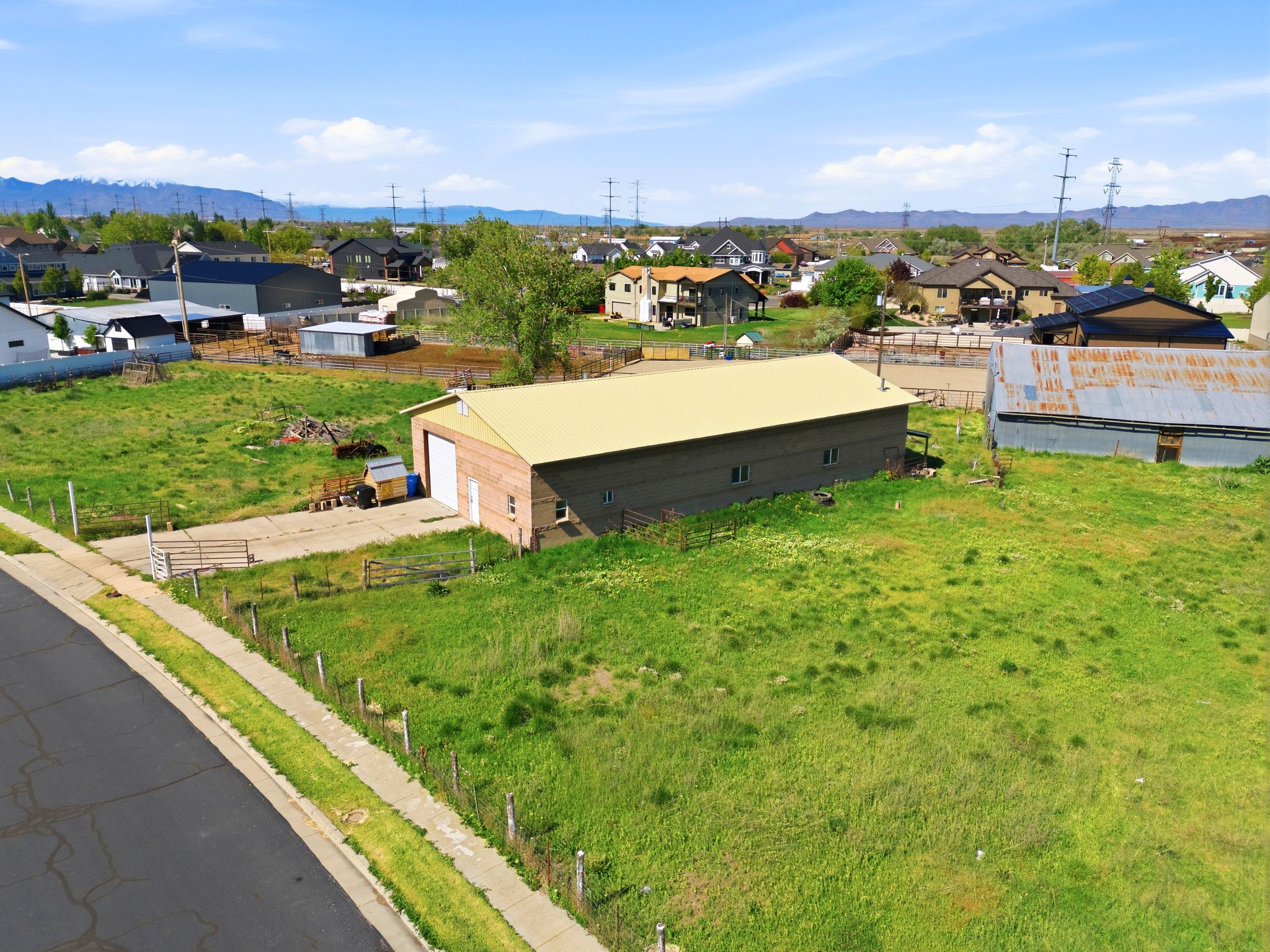 Aerial perspective of suburban area with a mountainous background