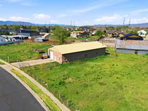 Aerial perspective of suburban area with a mountainous background