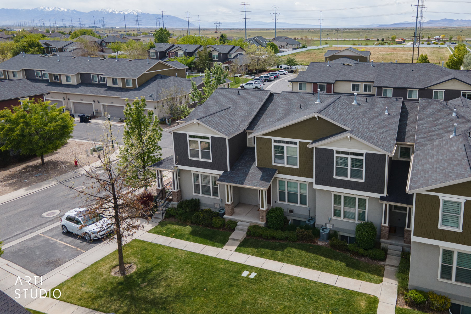 Aerial view of residential area featuring a mountain backdrop