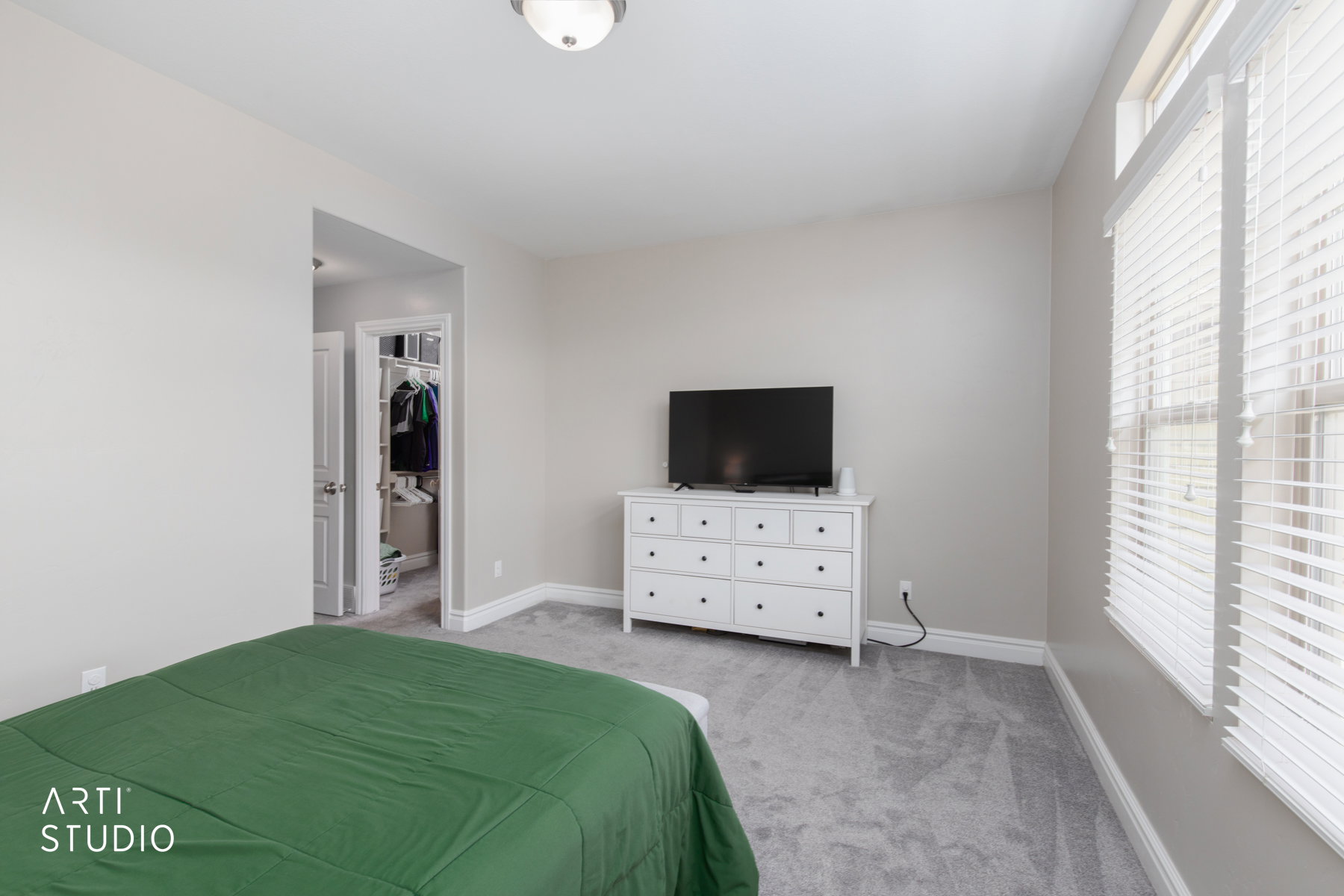 Primary bedroom with lots of natural light