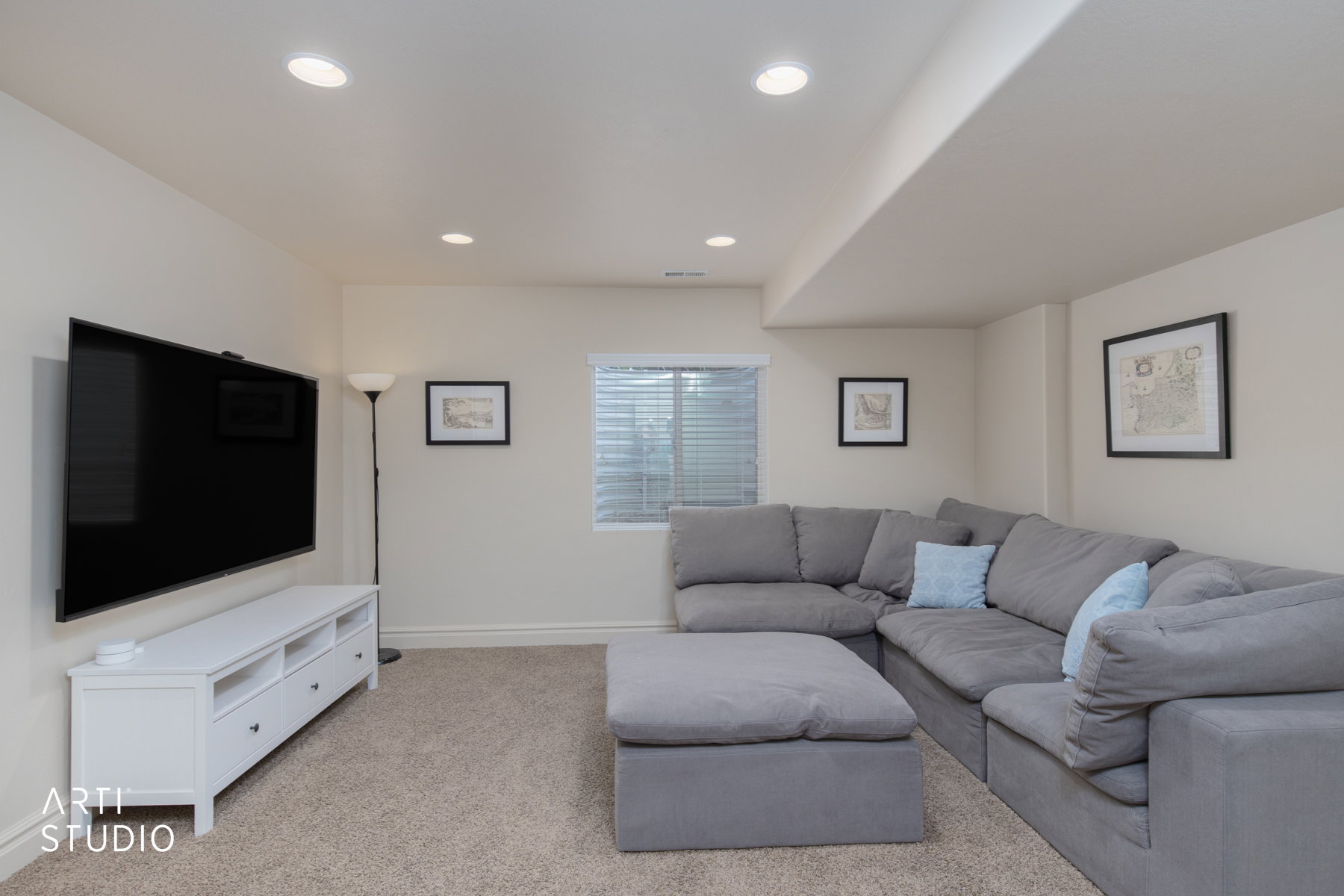 Living room with carpet floors and recessed lighting