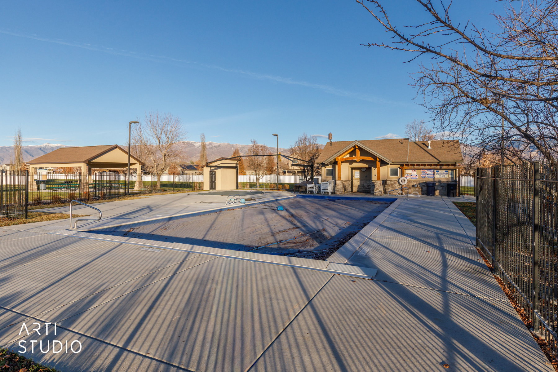 View of pool with a residential view and a mountain view