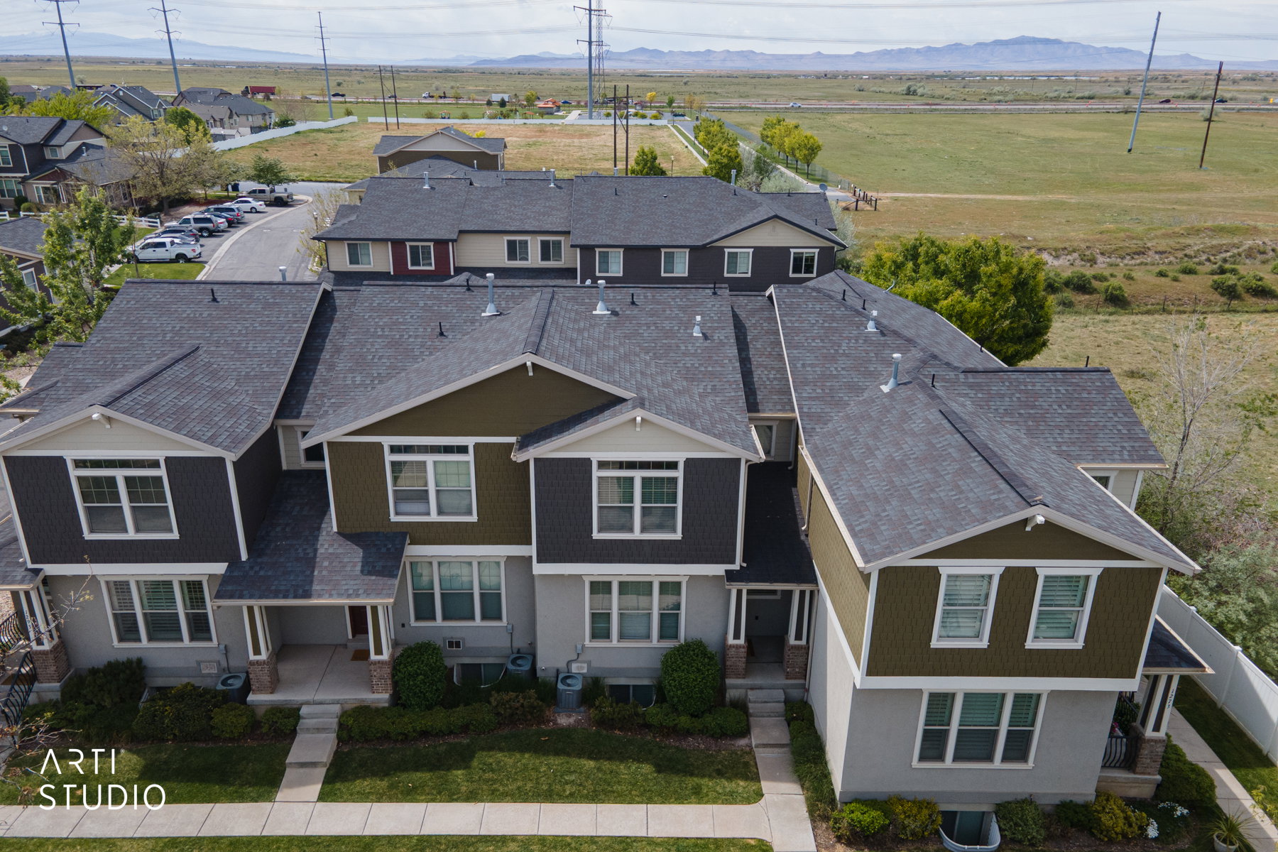 View of front of home with a residential view and a mountain view