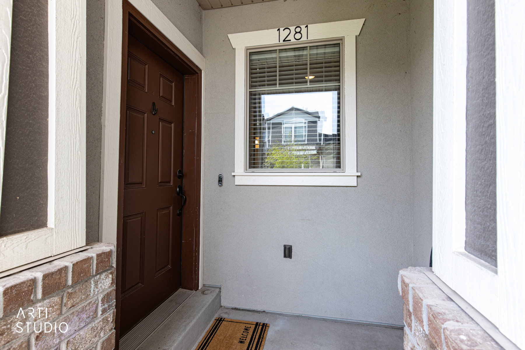 Entrance to property with stucco siding
