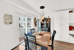 Dining space with light wood finished floors and baseboards