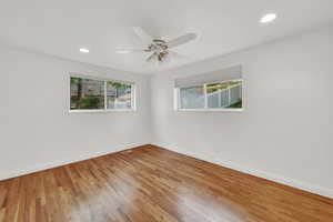 Unfurnished room featuring light wood-style floors, a ceiling fan, and recessed lighting