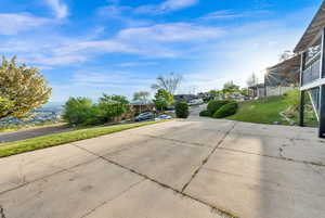 View of green lawn featuring a residential view