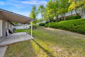 Fenced backyard featuring a patio