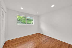 Unfurnished bedroom featuring recessed lighting, light wood finished floors, and a closet
