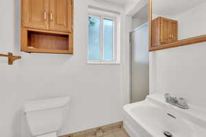 Bathroom featuring a sink and an enclosed shower