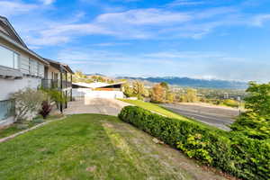 View of green lawn with a mountain view
