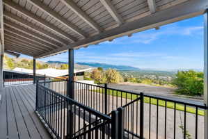 Wooden deck featuring a mountain view