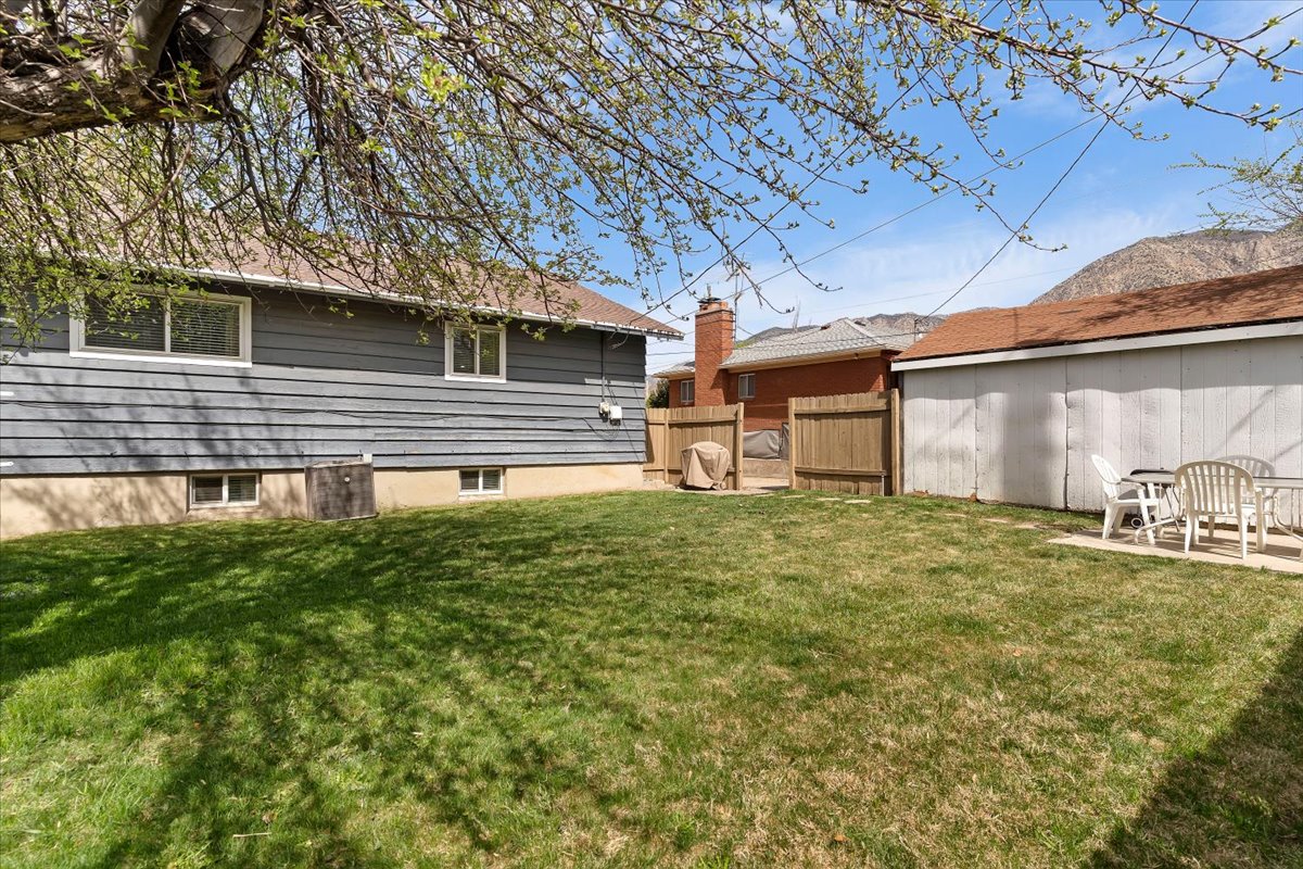 Fenced backyard with a patio